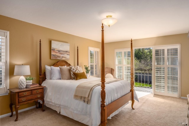 bedroom featuring access to exterior, carpet floors, and baseboards