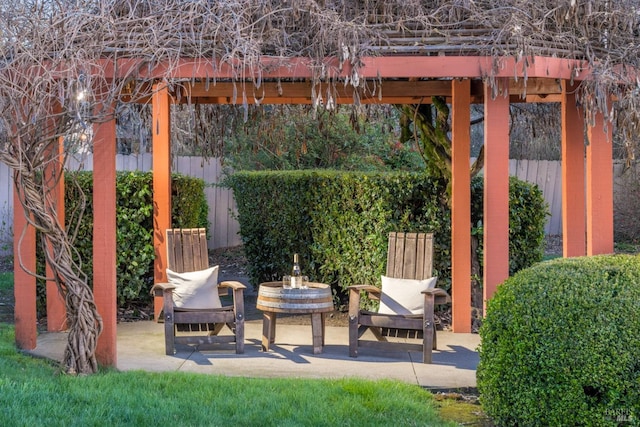 view of patio featuring fence