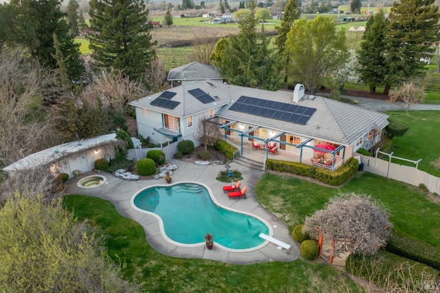 exterior space featuring a patio, a lawn, a fenced backyard, and a fenced in pool