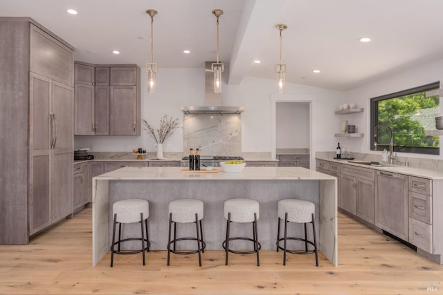 kitchen featuring lofted ceiling with beams, open shelves, a sink, dishwasher, and wall chimney exhaust hood