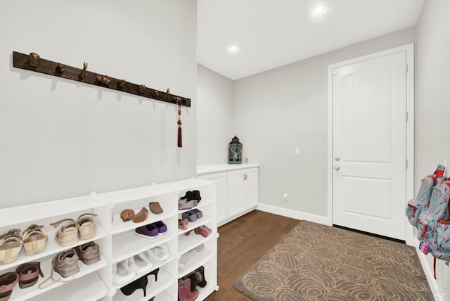 interior space with dark wood-style flooring, recessed lighting, and baseboards