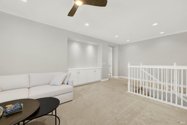 living area with light carpet, baseboards, crown molding, and recessed lighting