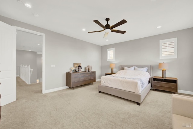 carpeted bedroom with a ceiling fan, recessed lighting, and baseboards