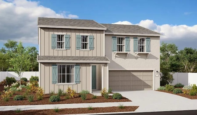 view of front of property with driveway, an attached garage, fence, and board and batten siding