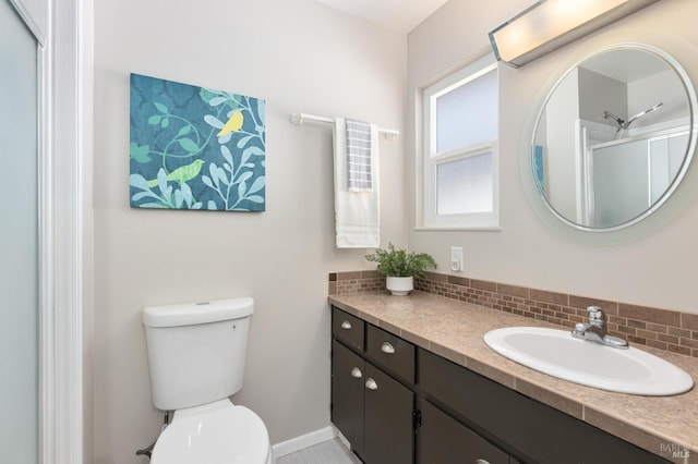 full bathroom with toilet, an enclosed shower, backsplash, and vanity