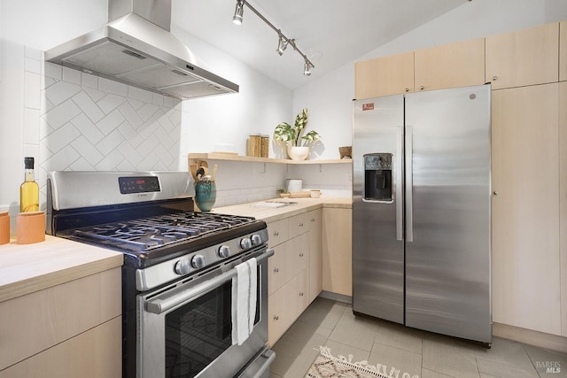 kitchen with wall chimney exhaust hood, appliances with stainless steel finishes, light countertops, and decorative backsplash