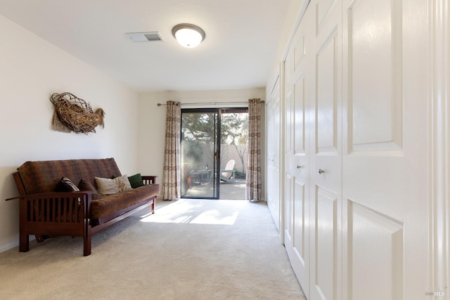 entryway with carpet and visible vents