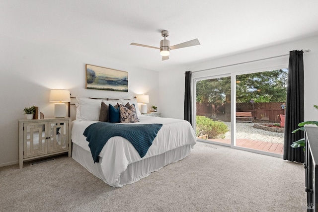 bedroom with access to exterior, ceiling fan, and carpet floors