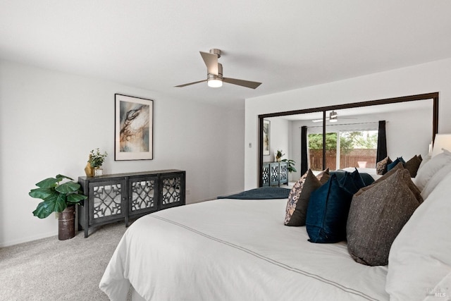 carpeted bedroom featuring ceiling fan and baseboards