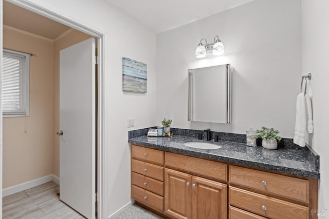 bathroom featuring vanity and baseboards