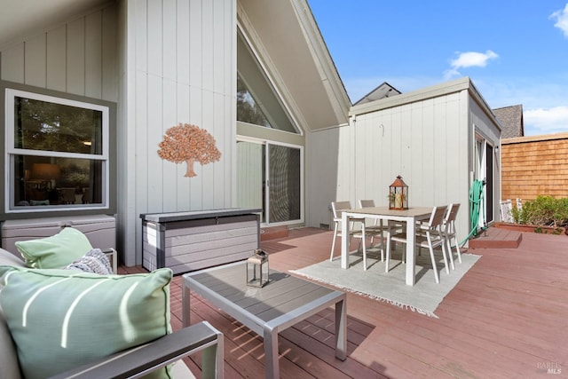 deck featuring outdoor dining area