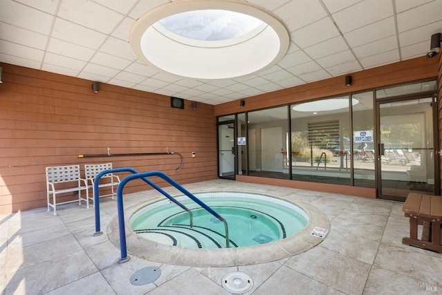 view of swimming pool featuring an indoor in ground hot tub