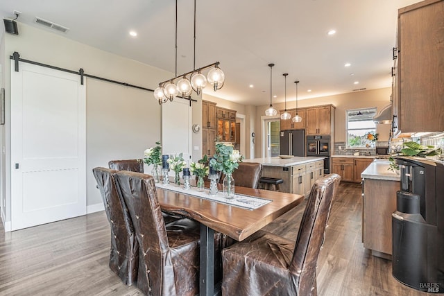 living area with dark wood finished floors, baseboards, and recessed lighting