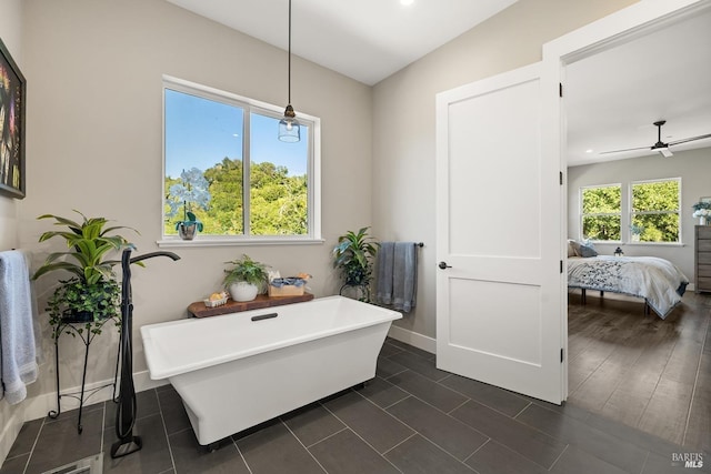 full bath with a ceiling fan, ensuite bathroom, a soaking tub, baseboards, and recessed lighting