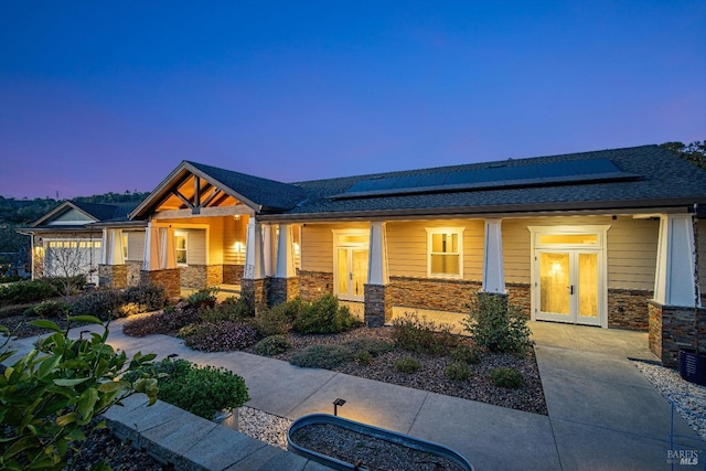 birds eye view of property with a wooded view and a mountain view