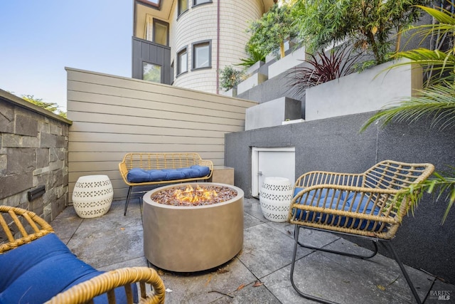 view of patio / terrace with a fire pit