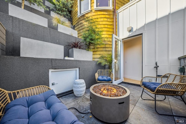 view of patio featuring a fire pit