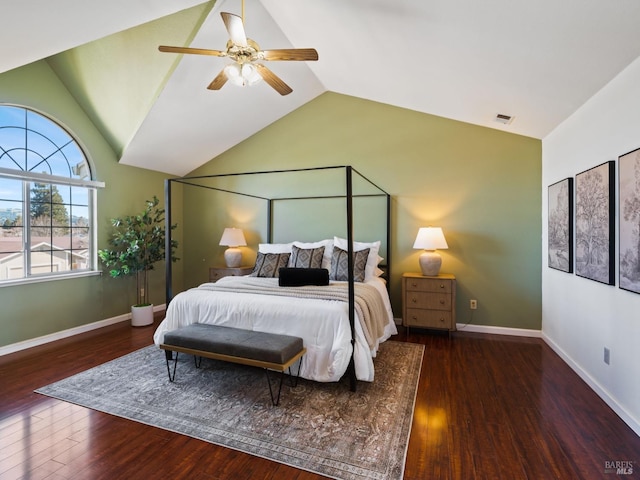 bedroom with vaulted ceiling, wood finished floors, baseboards, visible vents, and ceiling fan