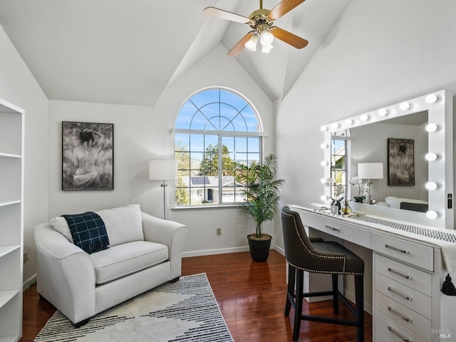 office featuring ceiling fan, dark wood-type flooring, plenty of natural light, and built in desk