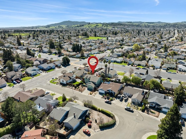 drone / aerial view featuring a mountain view and a residential view