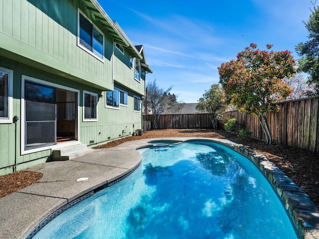 view of pool featuring a fenced backyard, central AC, a jacuzzi, and a fenced in pool