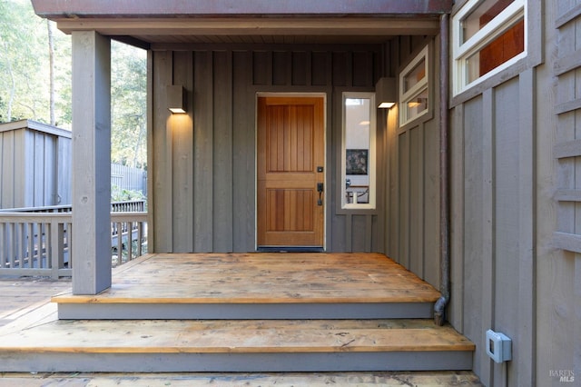 entrance to property featuring board and batten siding