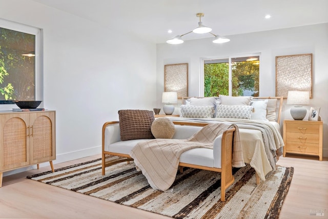 bedroom featuring recessed lighting, baseboards, and light wood finished floors