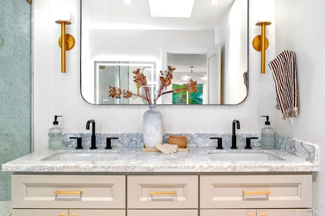 bathroom with double vanity and a sink