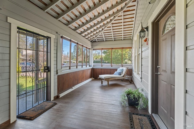 sunroom / solarium with wood ceiling and vaulted ceiling with beams