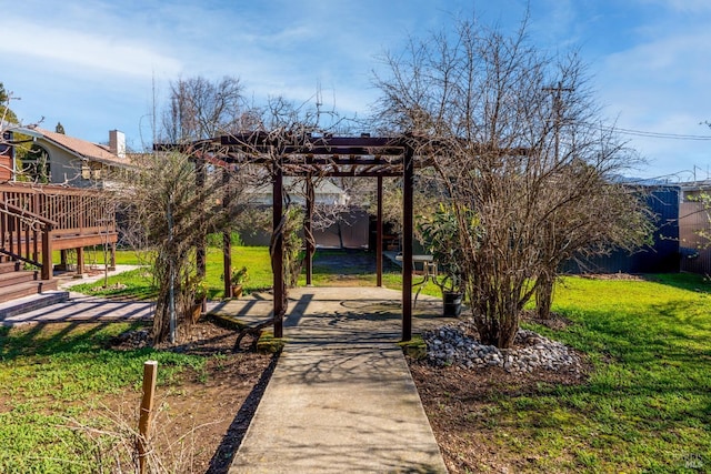 view of home's community with a lawn, a patio area, and a pergola