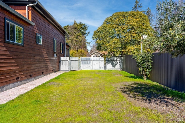 view of yard with a fenced backyard