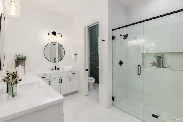 full bathroom with vanity, toilet, and a shower stall