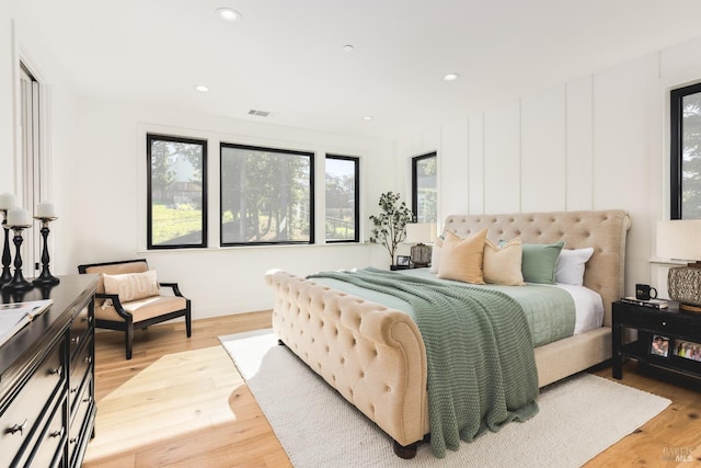 bedroom with recessed lighting, visible vents, and light wood-style flooring