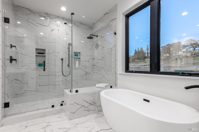 full bath featuring a marble finish shower, a freestanding bath, and marble finish floor