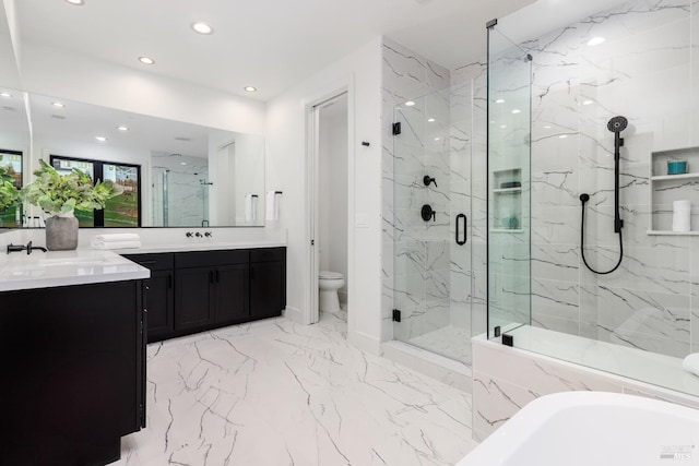 bathroom with a marble finish shower, recessed lighting, marble finish floor, and vanity