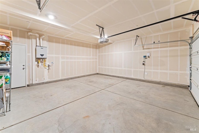 garage featuring tankless water heater and a garage door opener