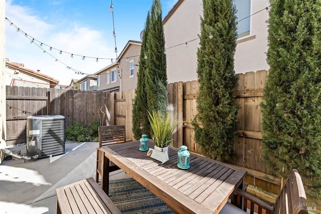 view of patio / terrace featuring a fenced backyard and central AC unit
