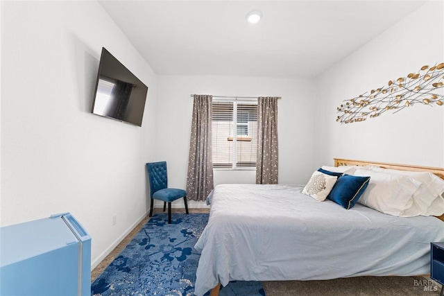 carpeted bedroom with baseboards