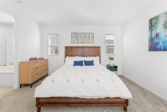 carpeted bedroom featuring baseboards