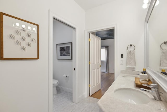 1211 Grand Ave, San Rafael, CA 94901 - bathroom with tile patterned flooring, toilet, baseboards, and double vanity