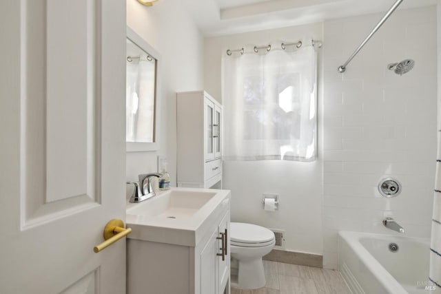 bathroom featuring visible vents, vanity, shower / tub combination, and toilet