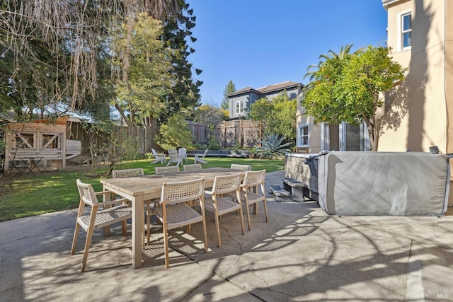 view of patio featuring fence and outdoor dining space