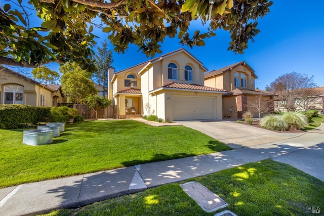 mediterranean / spanish house with a front lawn, driveway, a tiled roof, an attached garage, and stucco siding