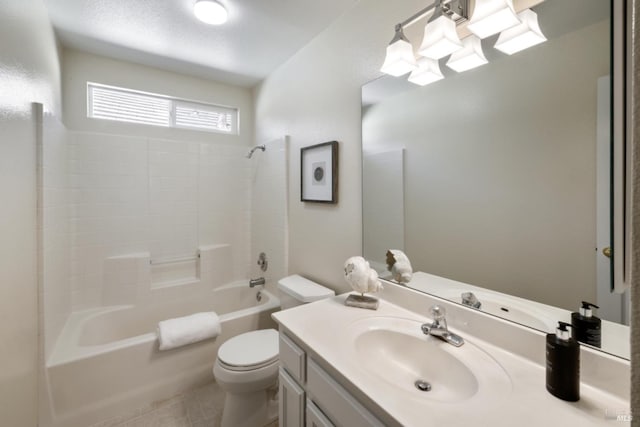 full bath featuring washtub / shower combination, vanity, toilet, and a textured ceiling