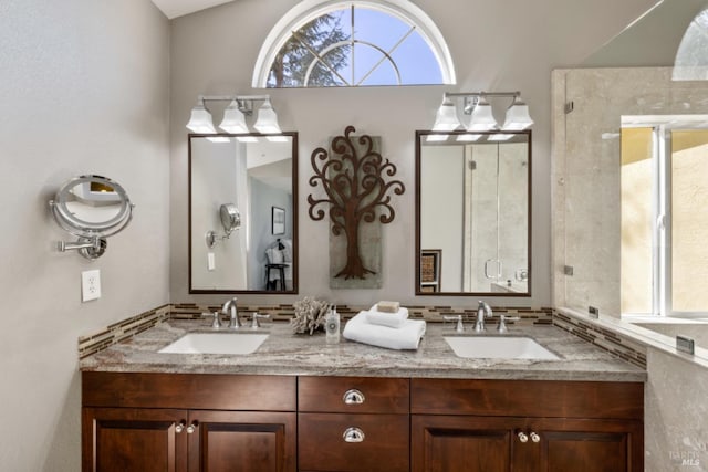 bathroom featuring double vanity and a sink