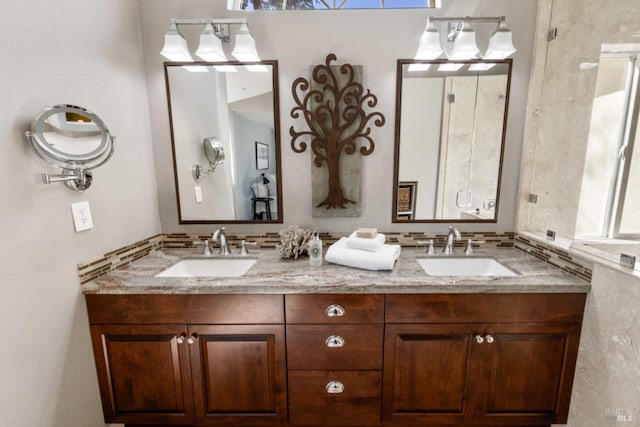 bathroom with double vanity and a sink