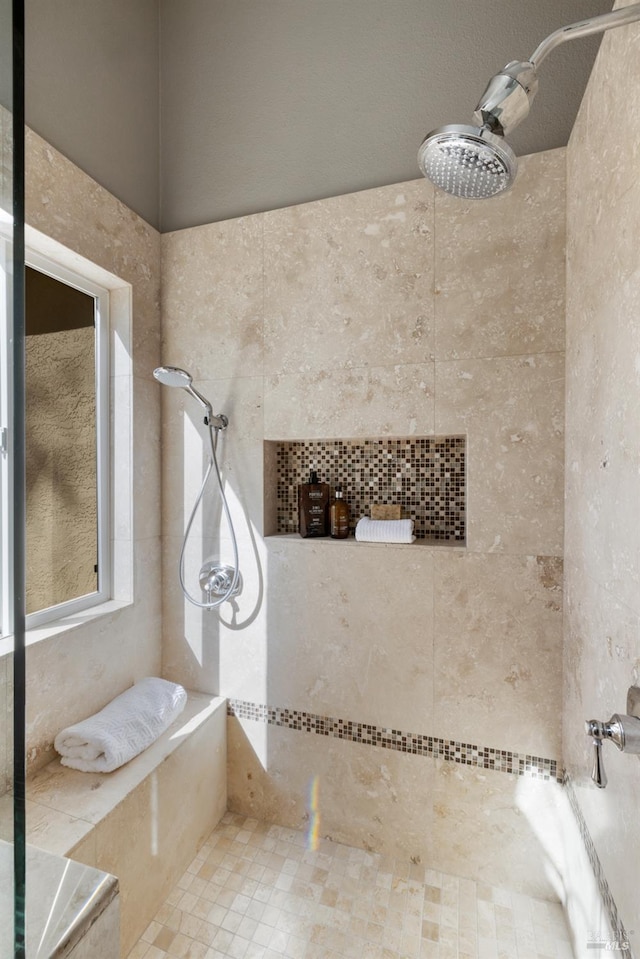 bathroom featuring tiled shower