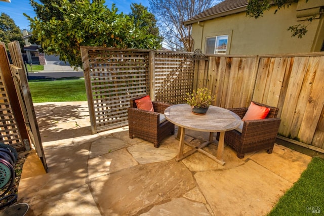view of patio / terrace with fence