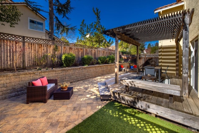 view of patio / terrace with a pergola, an outdoor living space, outdoor dining space, a fenced backyard, and a wooden deck
