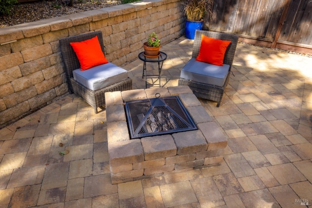 view of patio featuring an outdoor fire pit